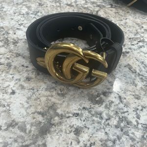 Gucci belt black with gold buckle very nice worn but in very good condition